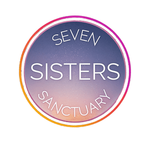 Logo with text 'Seven Sisters Sanctuary' on starry sunset background in circular design.